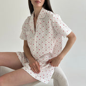 Shorts and short-sleeved muslin flower shirt suit on white