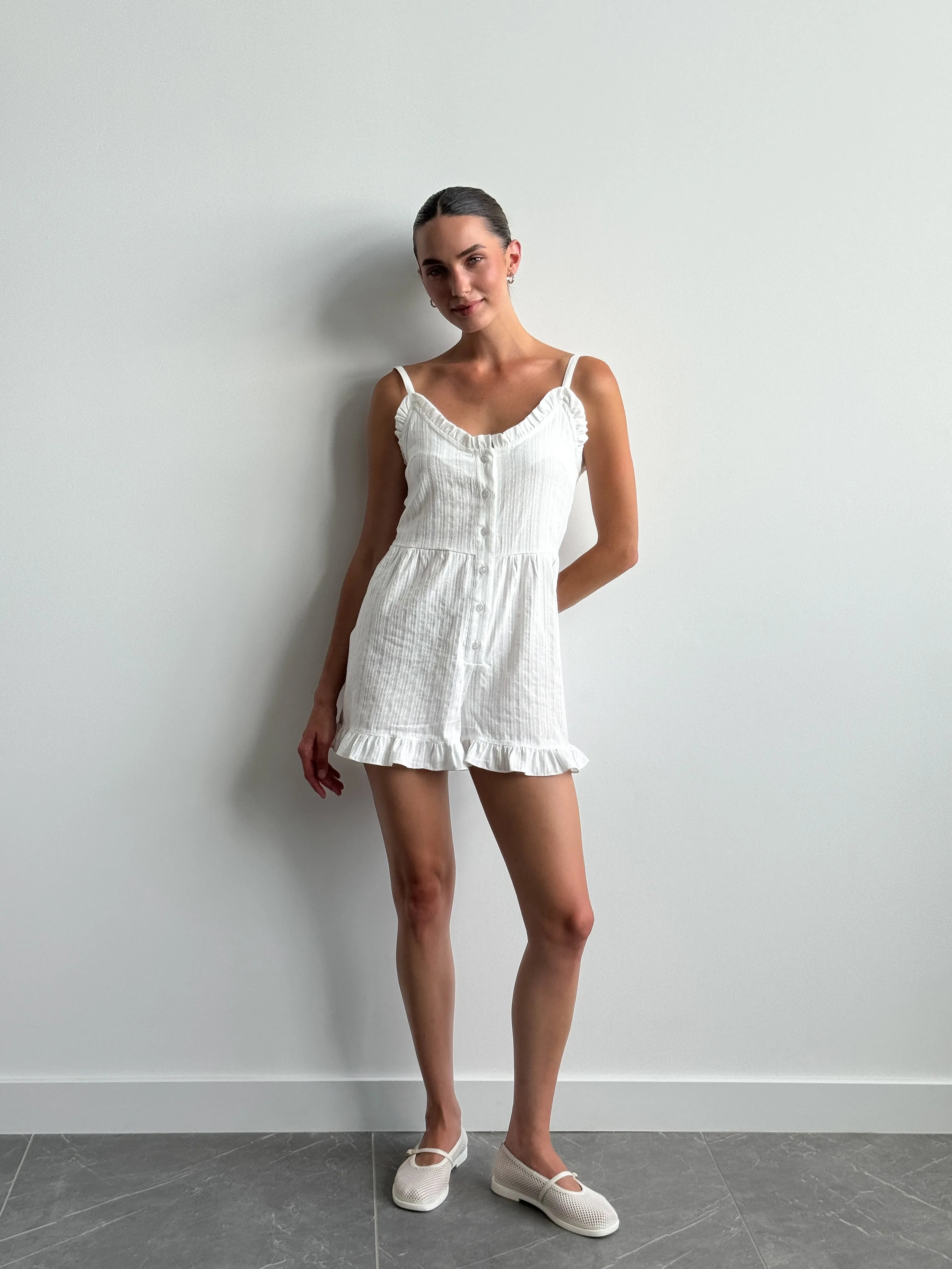 Women's white cambric jumpsuit with a pattern