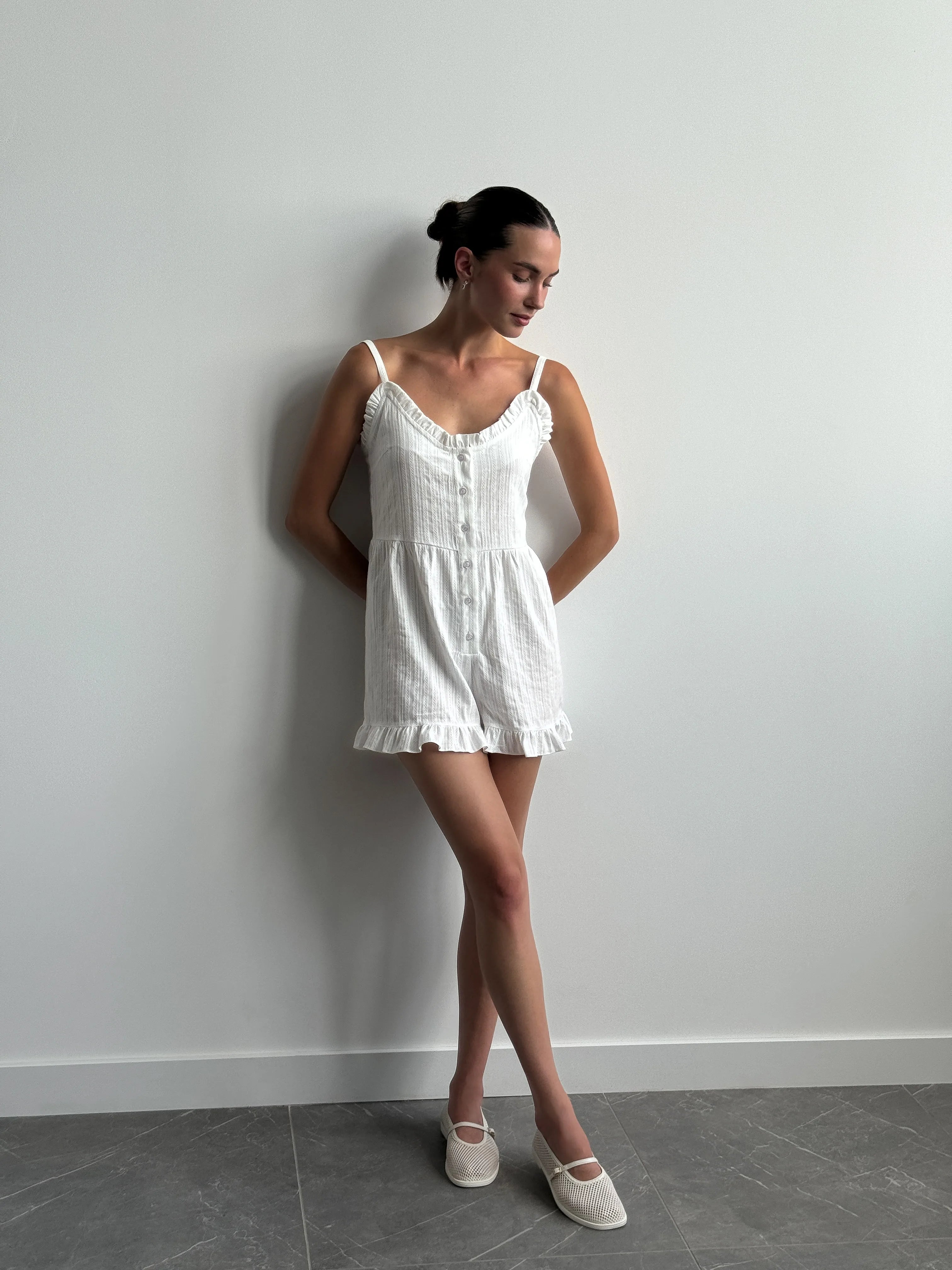 Women's white cambric jumpsuit with a pattern