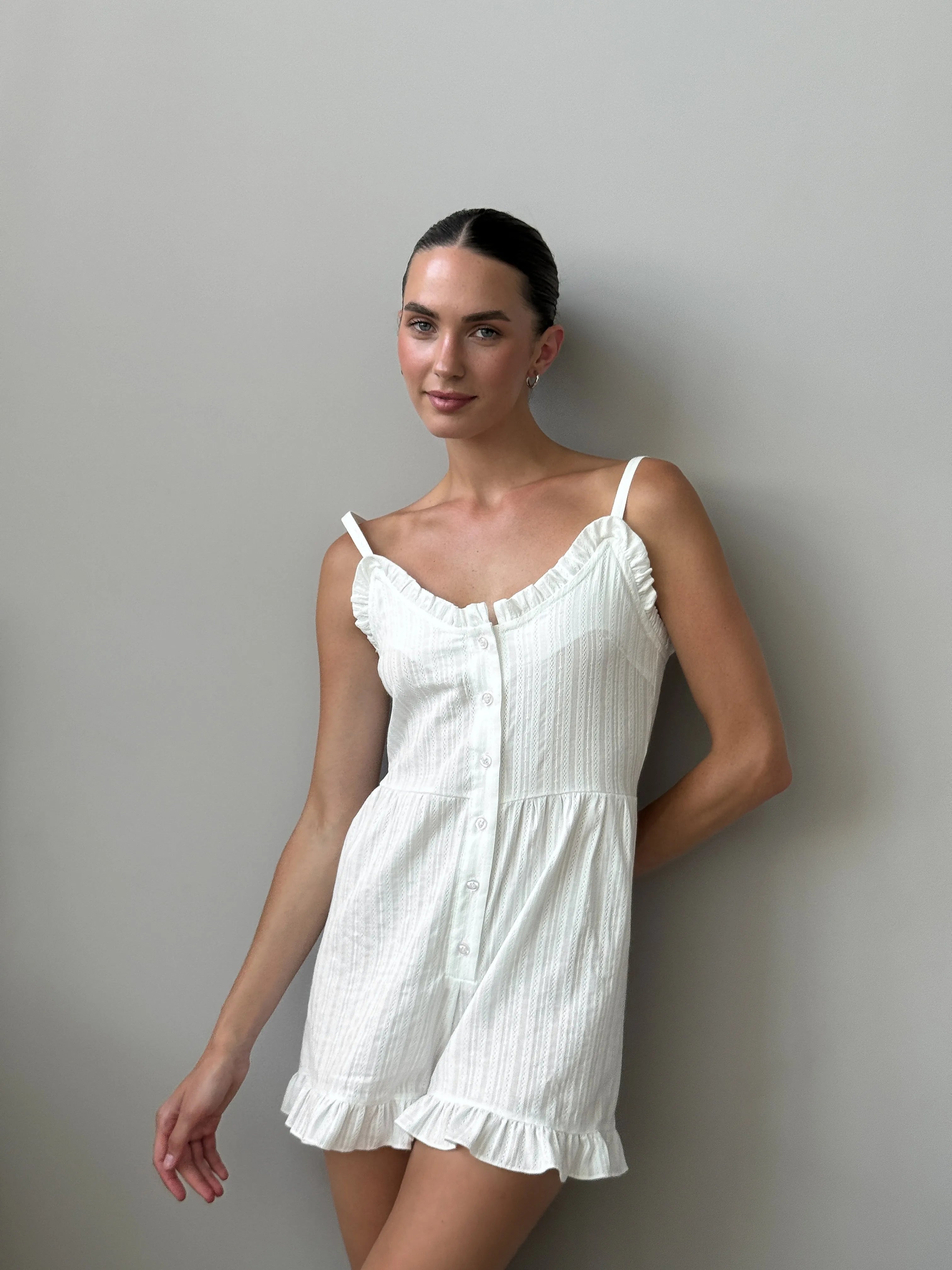 Women's white cambric jumpsuit with a pattern
