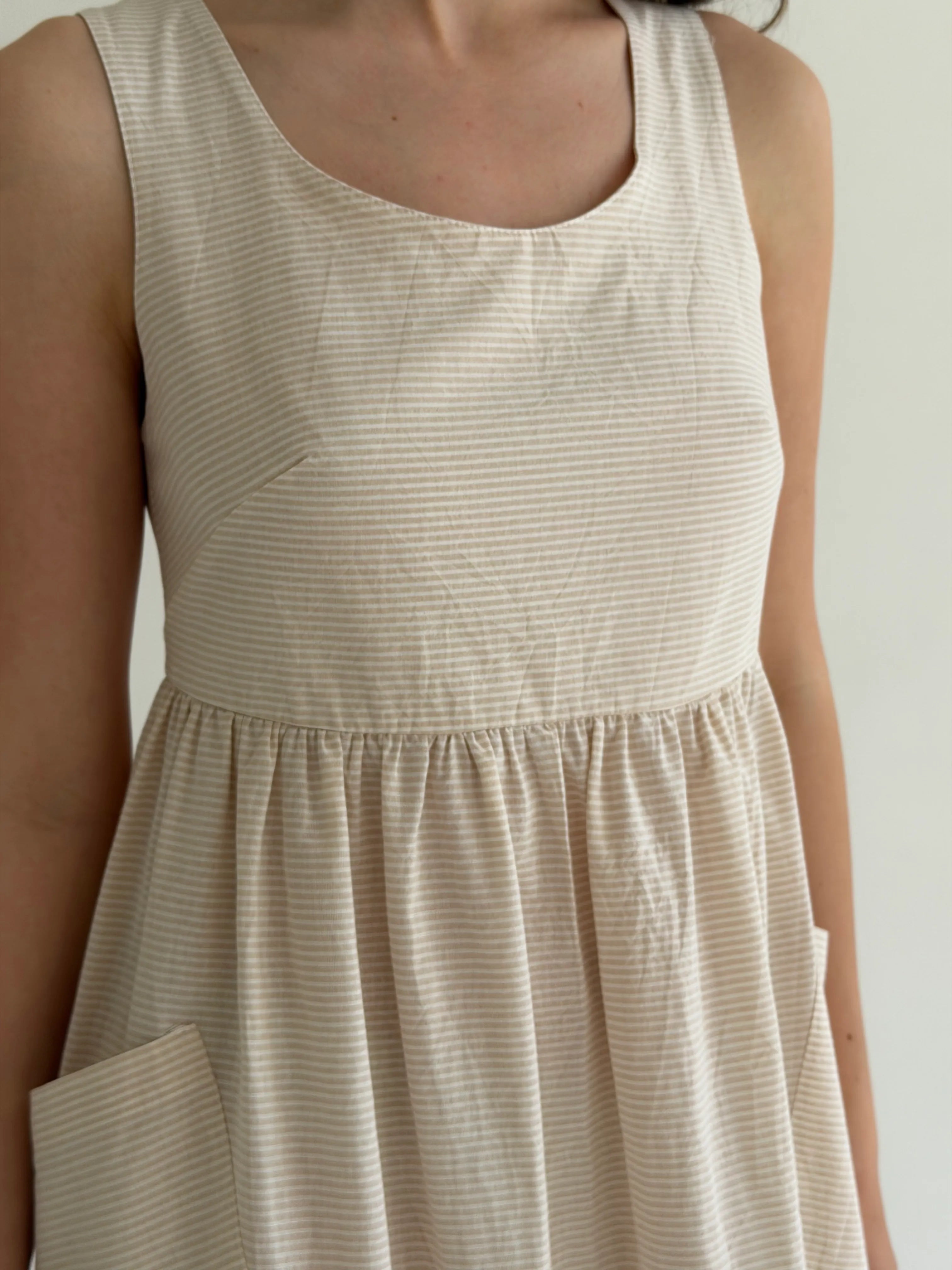 Cotton sundress, thin stripe, with patch pockets, beige/milk