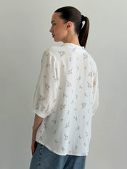 Muslin shirt flower with blue leaf on milky