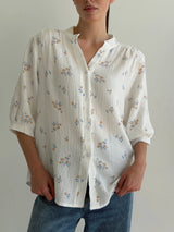 Muslin shirt flower with blue leaf on milky