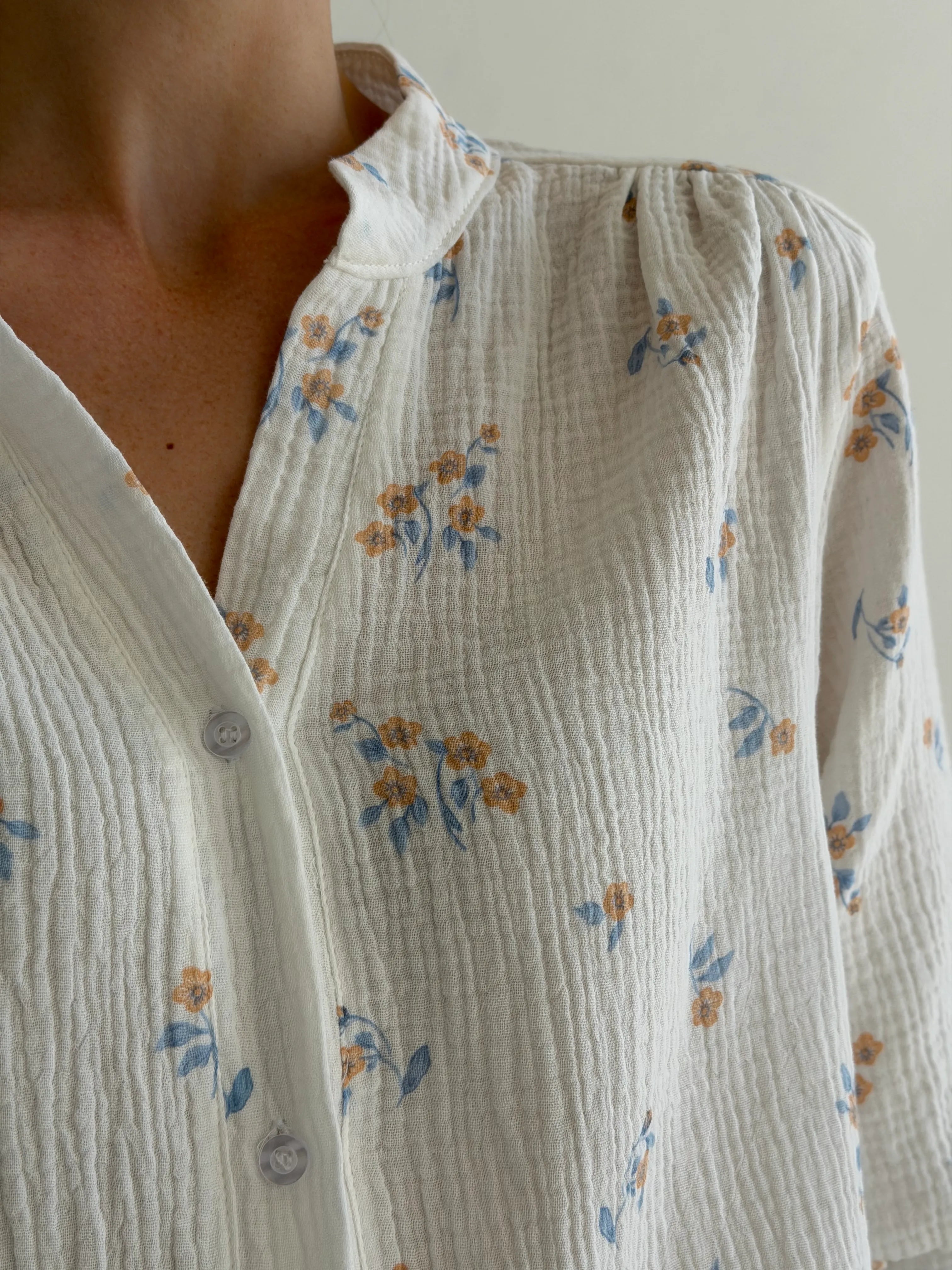 Muslin shirt flower with blue leaf on milky