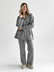Set knitted cardigan with belt and gray pants