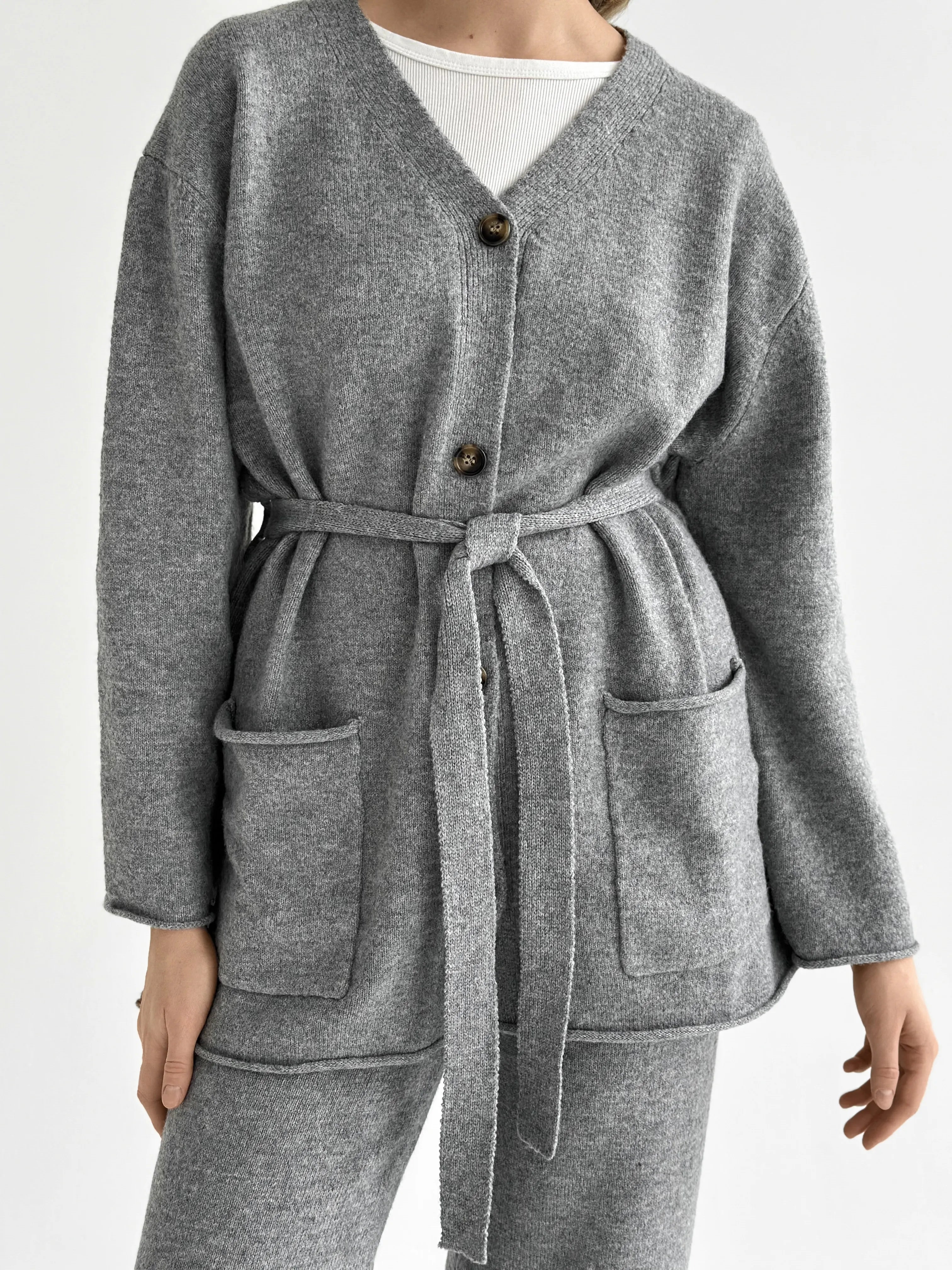 Set knitted cardigan with belt and gray pants