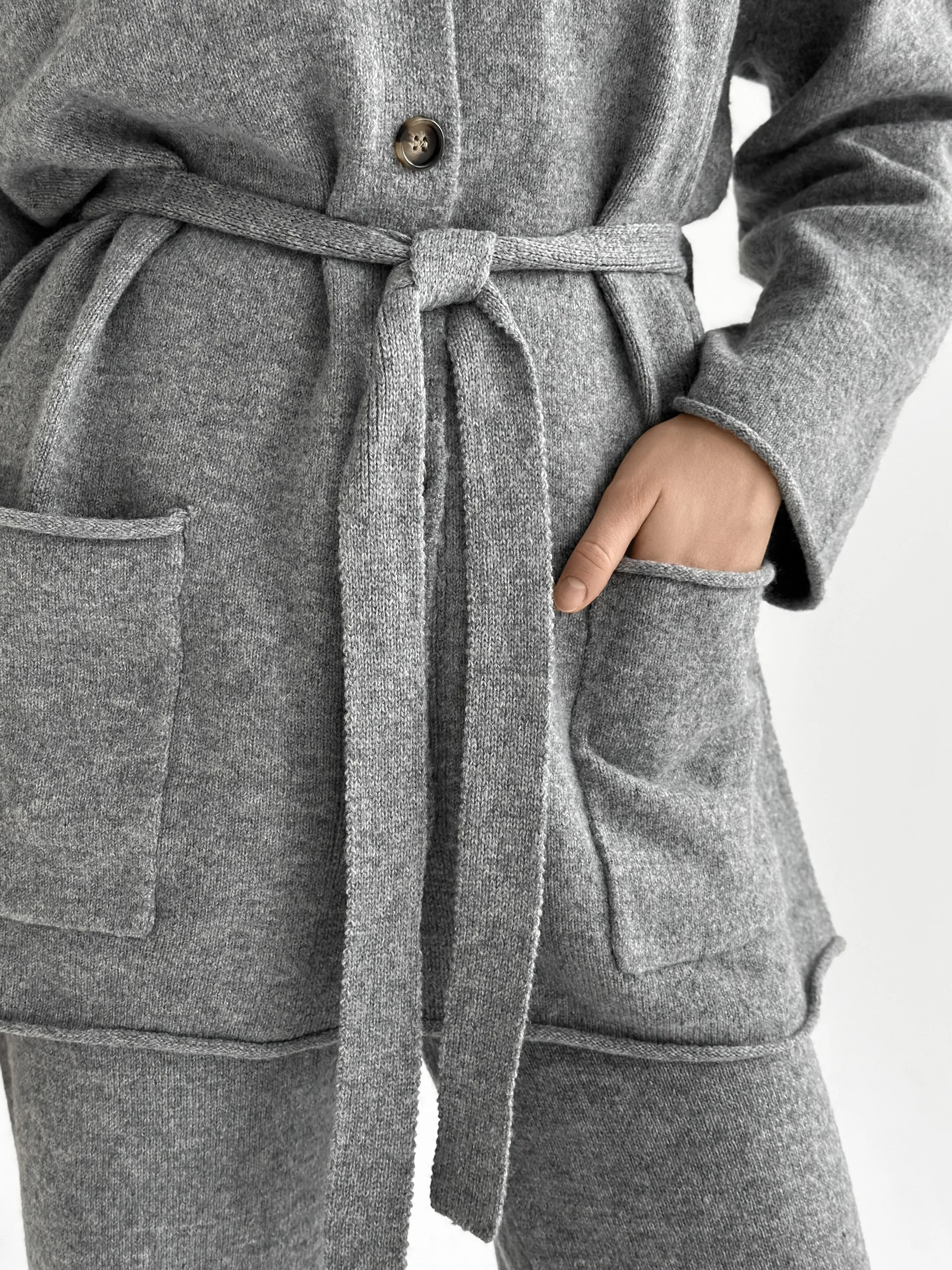 Set knitted cardigan with belt and gray pants