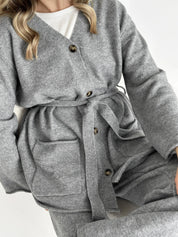 Set knitted cardigan with belt and gray pants