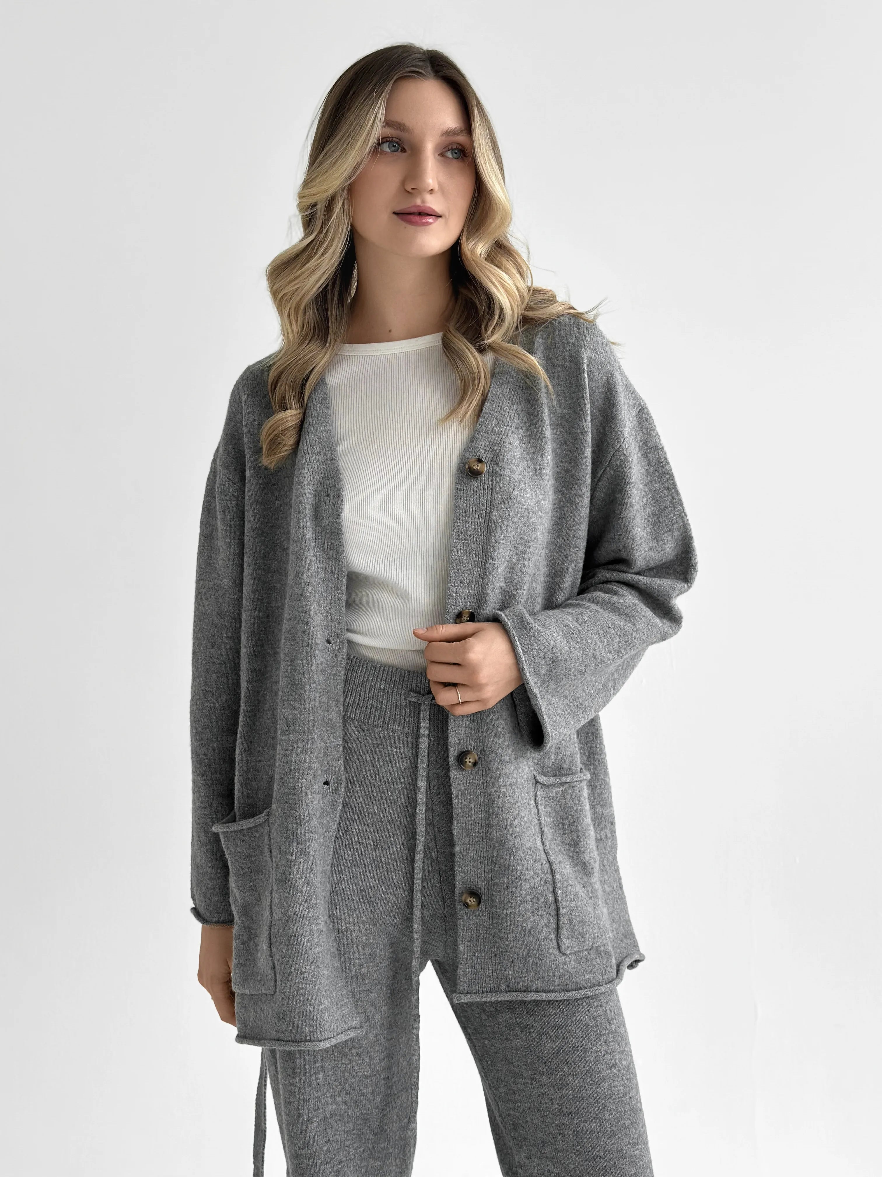 Set knitted cardigan with belt and gray pants
