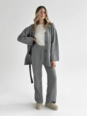 Set knitted cardigan with belt and gray pants