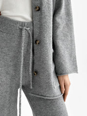 Set knitted cardigan with belt and gray pants