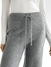 Set knitted cardigan with belt and gray pants