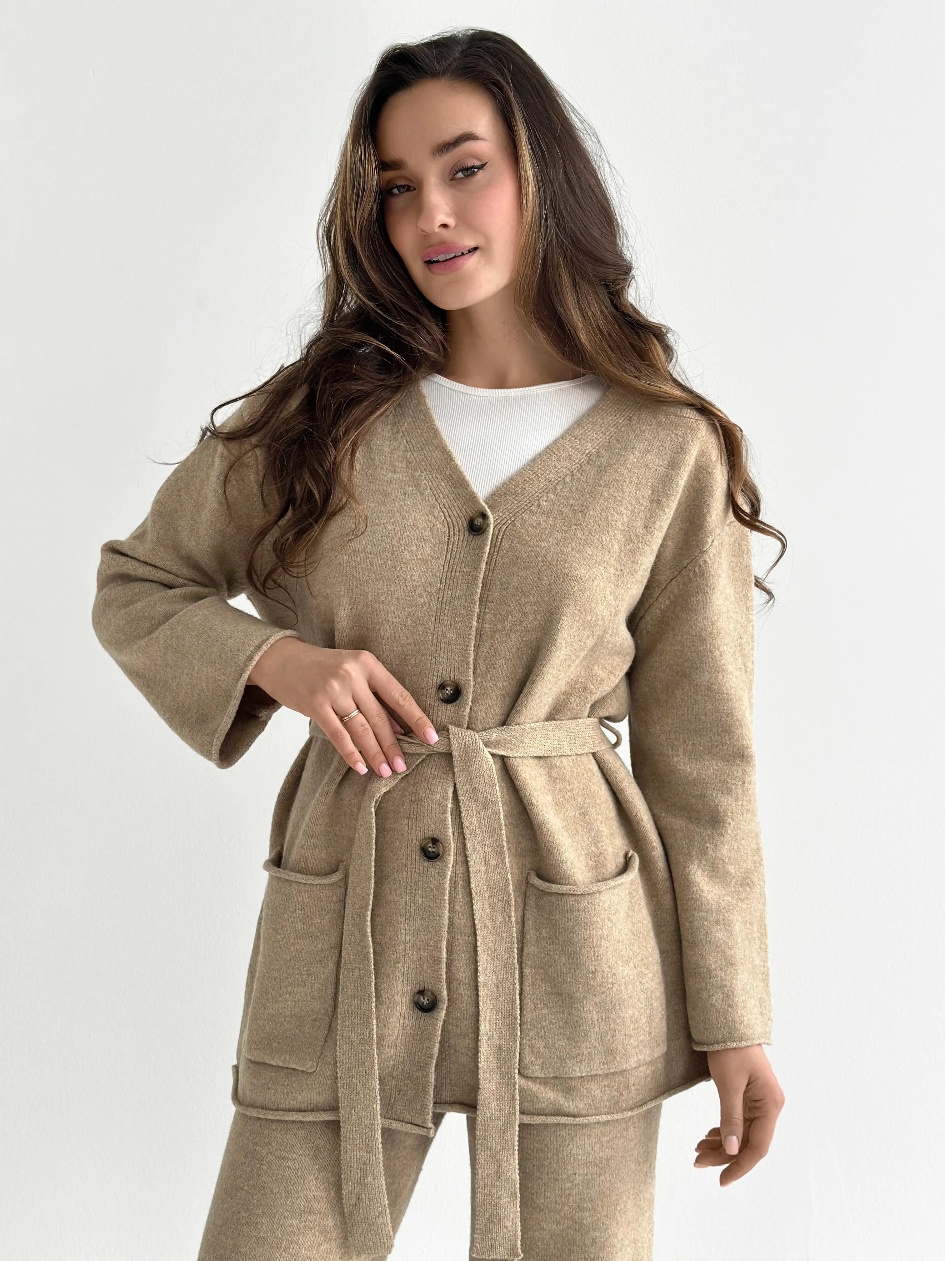 Set knitted cardigan with belt and beige pants