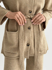 Set knitted cardigan with belt and beige pants