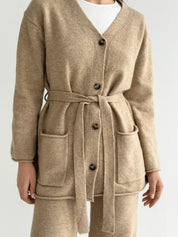 Set knitted cardigan with belt and beige pants
