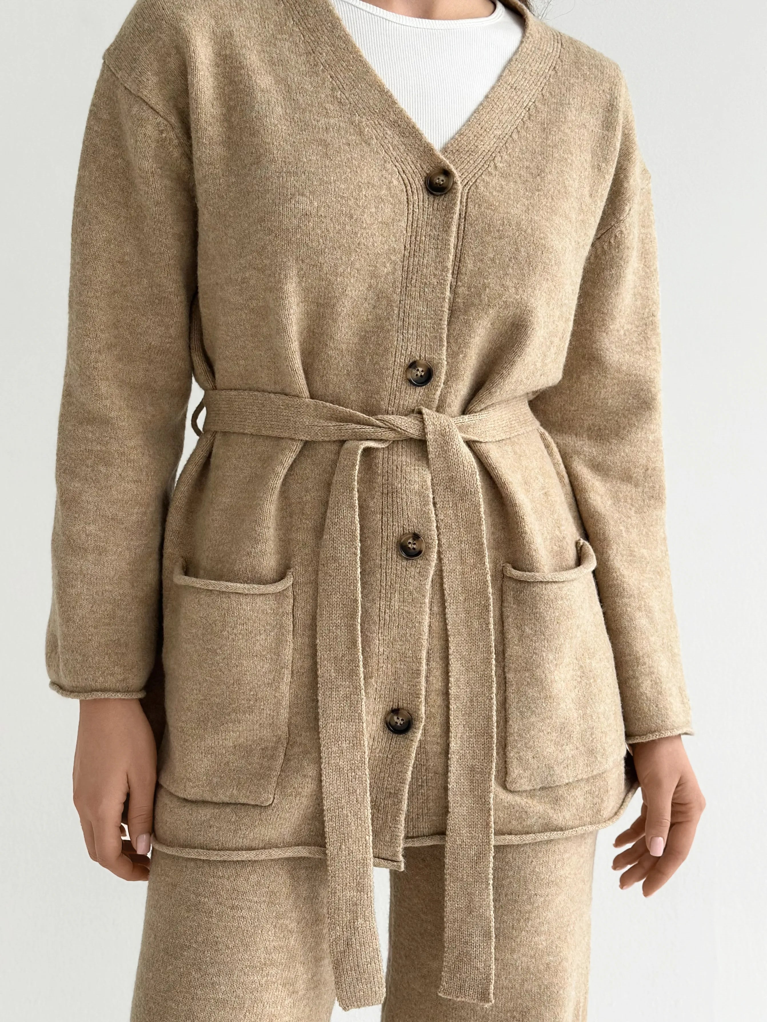 Set knitted cardigan with belt and beige pants