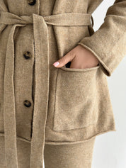 Set knitted cardigan with belt and beige pants