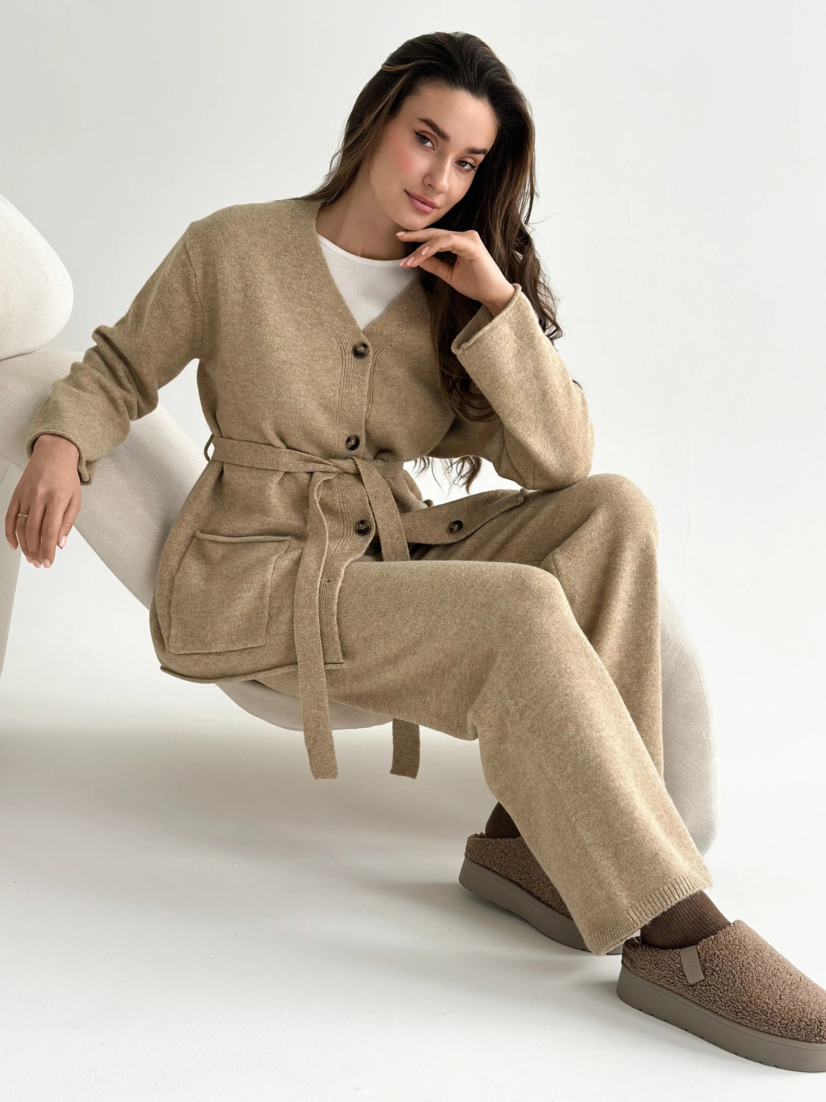 Set knitted cardigan with belt and beige pants