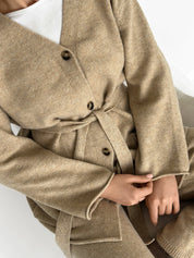 Set knitted cardigan with belt and beige pants