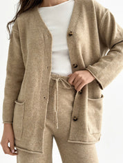 Set knitted cardigan with belt and beige pants